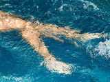 Fototapeta Łazienka - boy swimming in the pool