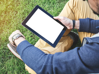 Man's hands using a digital Tablet Mockup with blank white screen