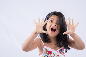 cute girl showing her colorful hands, surprised. Indian young girl with palm painted, asian girl and palm painting, palm printing