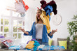 Aggressive frustrated woman throws laundry in the air