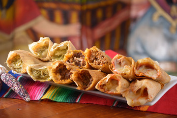 Wall Mural - Traditional Mexican food tamales platter with red corn