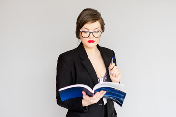 Wall Mural - girl in a business suit and glasses