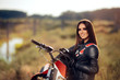 © nicoletaionescu - Female Motocross Racer Next to Her Motorcycle