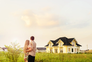 couple looking on house