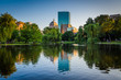 The lake at the Boston Public Garden and buildings at Copley Squ