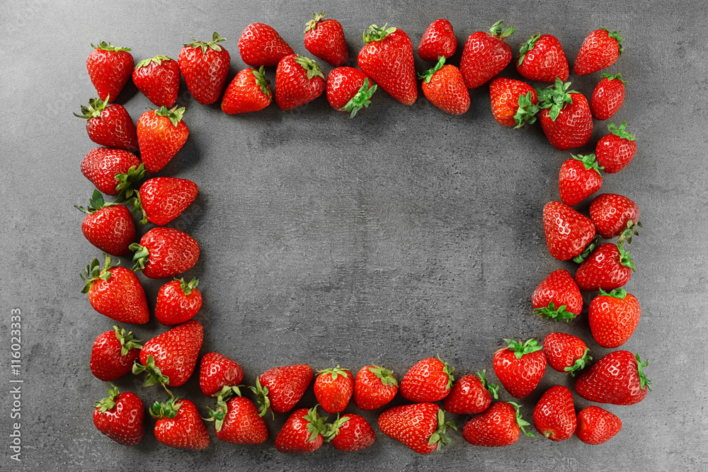 Strawberries frame on grey background