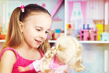 girl playing with doll