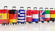 © lchumpitaz - Travel destination and journey luggage concept, stack of suitcases in colors of national flags of european countries isolated on white background. 3d rendering