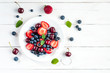 © Flaffy - fruit salad on white wooden background, top view, flat lay