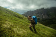 © Artem - man climbs a mountain at the beautiful view