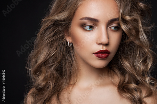 Fotografie, Obraz Beautiful girl with long wavy hair . Blonde with curly hairstyle