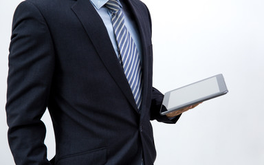 isolated business man hold the tablet on white background
