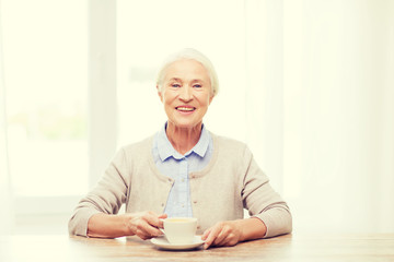 Wall Mural - happy senior woman with cup of coffee