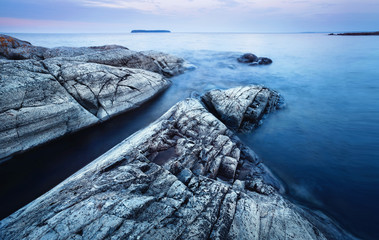 Wall Mural - stone beach stretching into the water