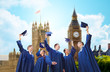 © Syda Productions - group of smiling students with mortarboards