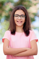 Wall Mural - Pretty preteenager girl with glasses outside