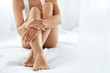 © puhhha - Woman Body Care. Close Up Of Long Legs With Soft Skin And Hands