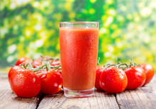 Glass Of Tomato Juice On Wooden Table