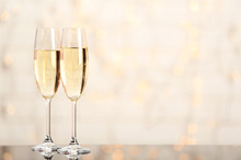 Two Champagne Glasses On Light Background
