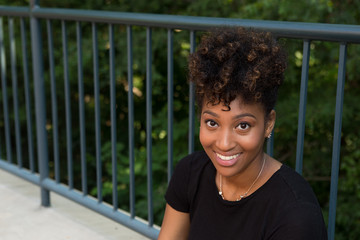 Wall Mural - Head shot of a young african american student on campus