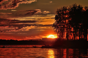 Wall Mural - landscape setting sun on the background of the river.