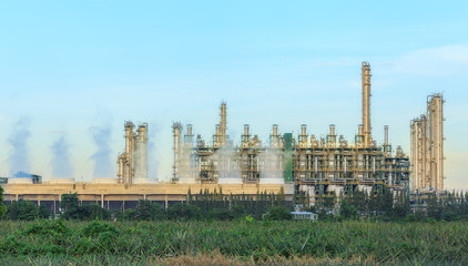 Wall Mural - Oil refinery plant with blue sky for energy industry background.