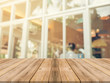 © tirachard - Wooden board empty table in front of blurred background. Perspective brown wood over blur in coffee shop - can be used for display or montage your products.Mock up for display of product.