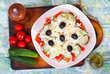 Traditional classic Shopska salad with tomatoes, peppers, cucumbers and cheese. Bulgarian cuisine, Balkan culture