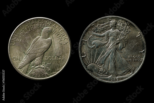 Poster Two silver american dollars isolated on black