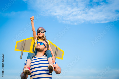 Kid and father playing outdoors