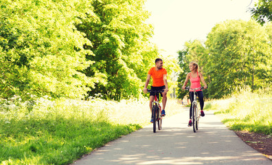 Wall Mural - happy couple riding bicycle outdoors