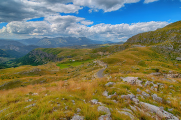 Wall Mural - Montenegro, national park Durmitor, mountains and clouds panorama. Sunlight lanscape. Nature travel background