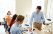 © Syda Productions - group of students and teacher with test results
