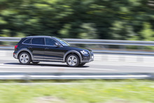 Car In Fast Motion With Panning Effect On Highway