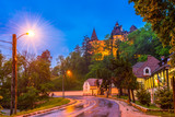 Fototapeta Uliczki - Traditional medieval architecture of Bran city and surroundings, down to the Dracula castle in evening lights, Romania