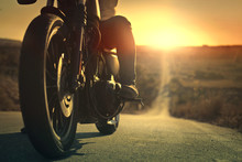 On A Roaring Motorcycle At Sunset