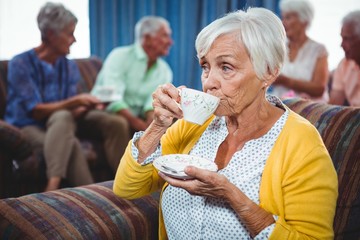 Wall Mural - senior woman drinking a cup of coffee