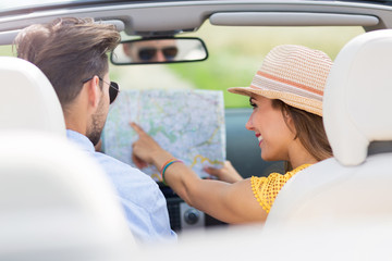 Wall Mural - Couple enjoying a drive in a convertible
