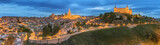 Fototapeta  - Panoramic view of ancient city and Alcazar on a hill over the Tagus River, Castilla la Mancha, Toledo, Spain