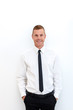 © Erika - Portrait of young happy smiling business man, isolated over white background
