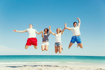 Company of young people on the beach