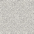 Hand drawn black dots on white background. Vector seamless pattern