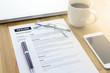 © thbangkok - Businessman or job seeker review his resume on his desk before send to finding a new job with pen, computer laptop, glasses, a cup of coffee and smart phone.