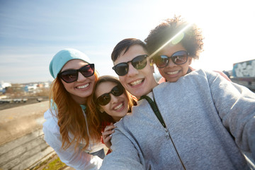 Poster - group of happy friends taking selfie on street