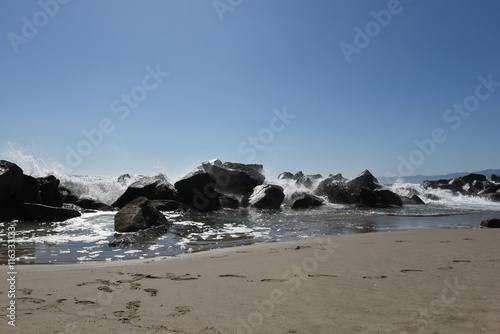 Poster long exposure at Venice beack with sea and rocks