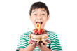 Little boy blowing candle on the cake for his birthday