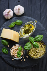 Wall Mural - Basil pesto sauce and its cooking ingredients, top view