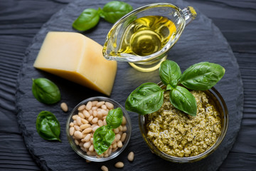 Wall Mural - Basil pesto, pine nuts, parmesan, olive oil and basil leaves