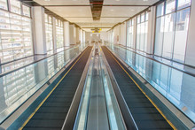Long Walkway Of Escalator At International Airport Terminal