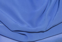 This Is A Photograph Of Blue Sheer Fabric